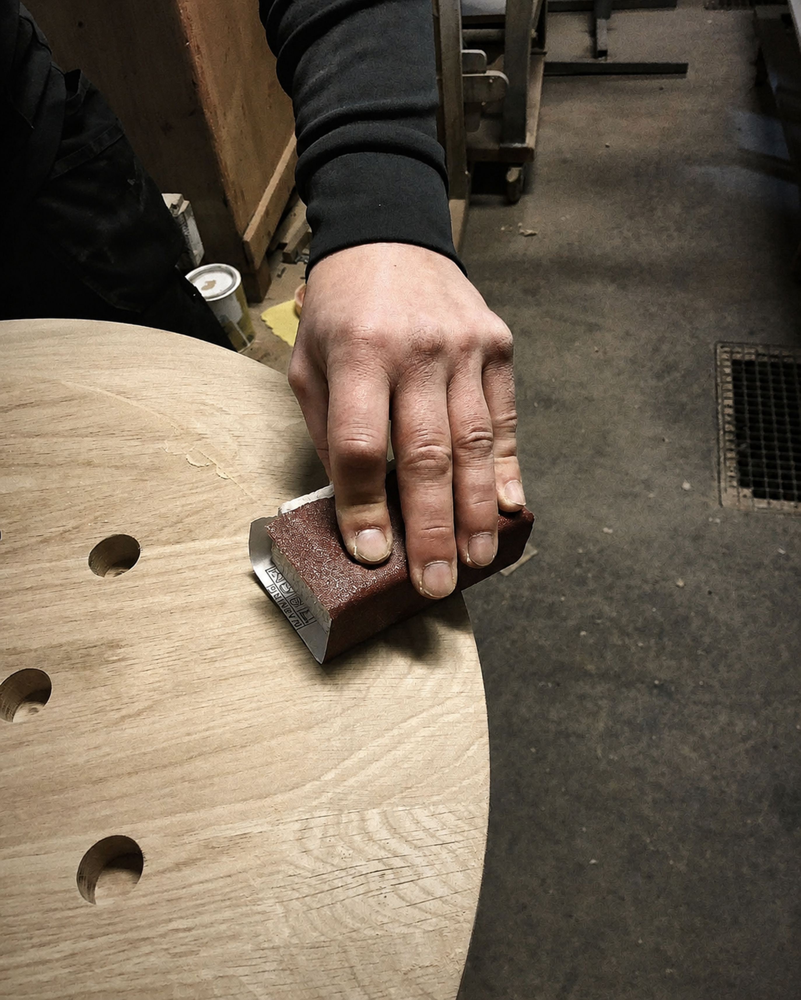 Wood being sanded by hand for a BEL ET BIEN piece